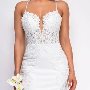 Off-White Mermaid illusion bridal gown with lace detailing.